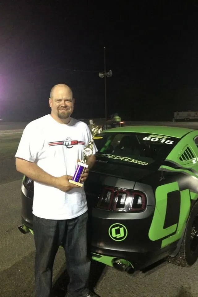 CJ Pony Parts video personality Bill Tumas jokingly claims the record of fastest naturally-aspirated S197 Mustang with one floor mat. Like most of us, his practice is to remove the driver side floor mat so that it doesn't get in the way of the gas pedal.