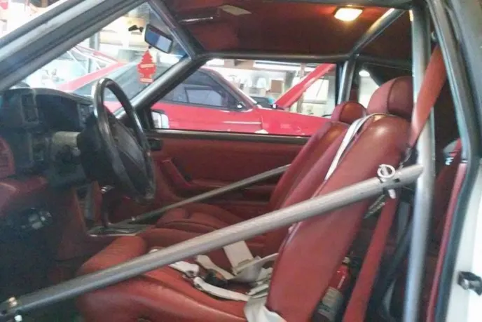 The Fox Mustang's red interior isn't a crowd favorite, but or Hafke it works. We're also told both the radio and the cigarette lighter works. It is a street car, ya know.