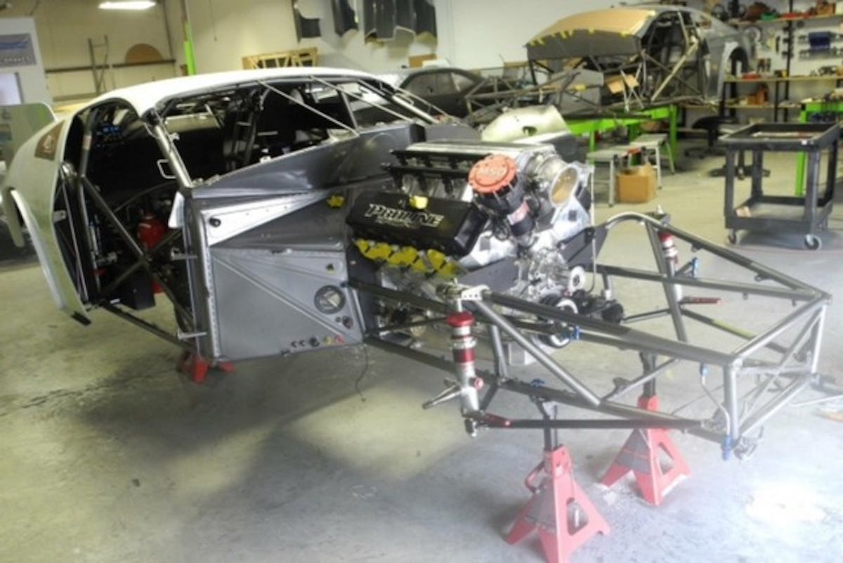 Once a wrecked car is at Vanishing Point Race Cars, the teardown begins. All suspension components are removed, before the car is put on a jig to make sure everything is straight. Kinzer's 350Z has a removable body, which makes it easier to service as a result of a crash.