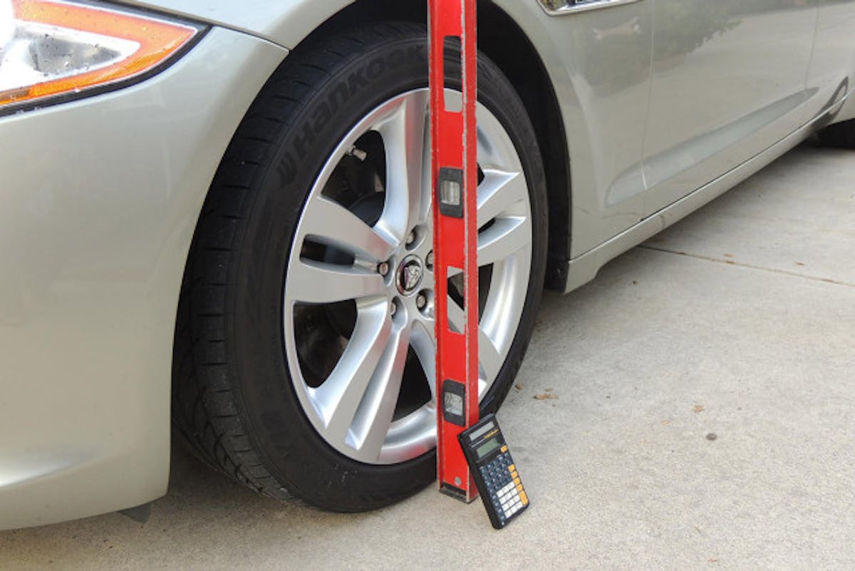 A bubble level with horizontal level capabilities also works. Set it against the tire as such and check the bubble. Author's image.