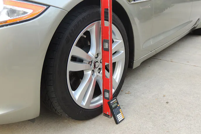 A bubble level with horizontal level capabilities also works. Set it against the tire as such and check the bubble. Author's image.