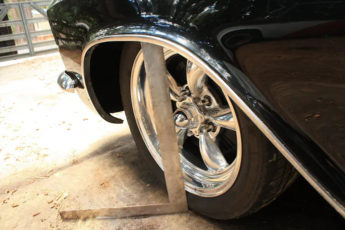 Place the long edge of the square against the sidewall with the leg on the ground. Image by Sam Goodman.