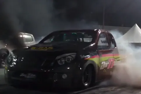 Lighting up the tires, this nitrous fed diesel stages for a run.