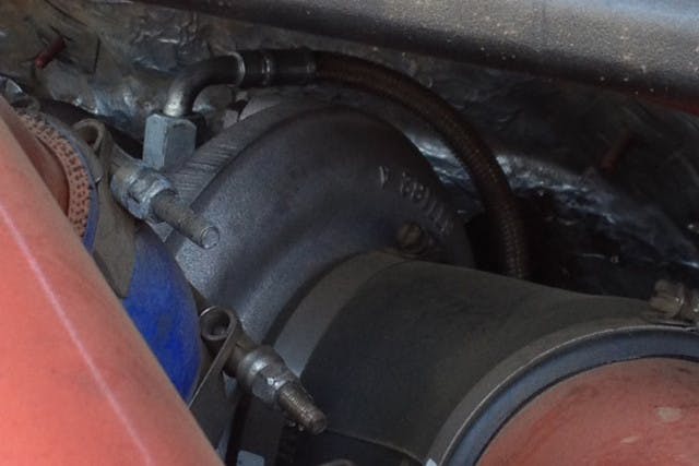 Borg Warner S366 turbo with billet wheel sits atop Irate Diesel TIG welded stainless pedestal.