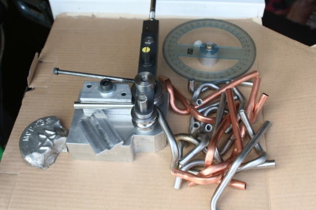 Headers were bent using this tubing bender. They were filled with low-melting point material and set aside to cool before the bending process. This allowed the tubes to stretch without cracking.