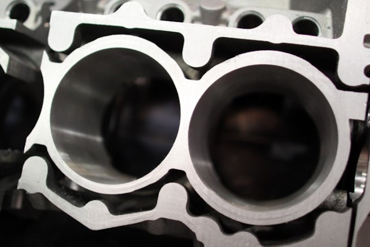 This cut-away shows the Siamese bores, meaning the bores are connected. This adds a great amount of stability to the bore. When a bore is out of round even by a small amount, ring seal and output suffers.