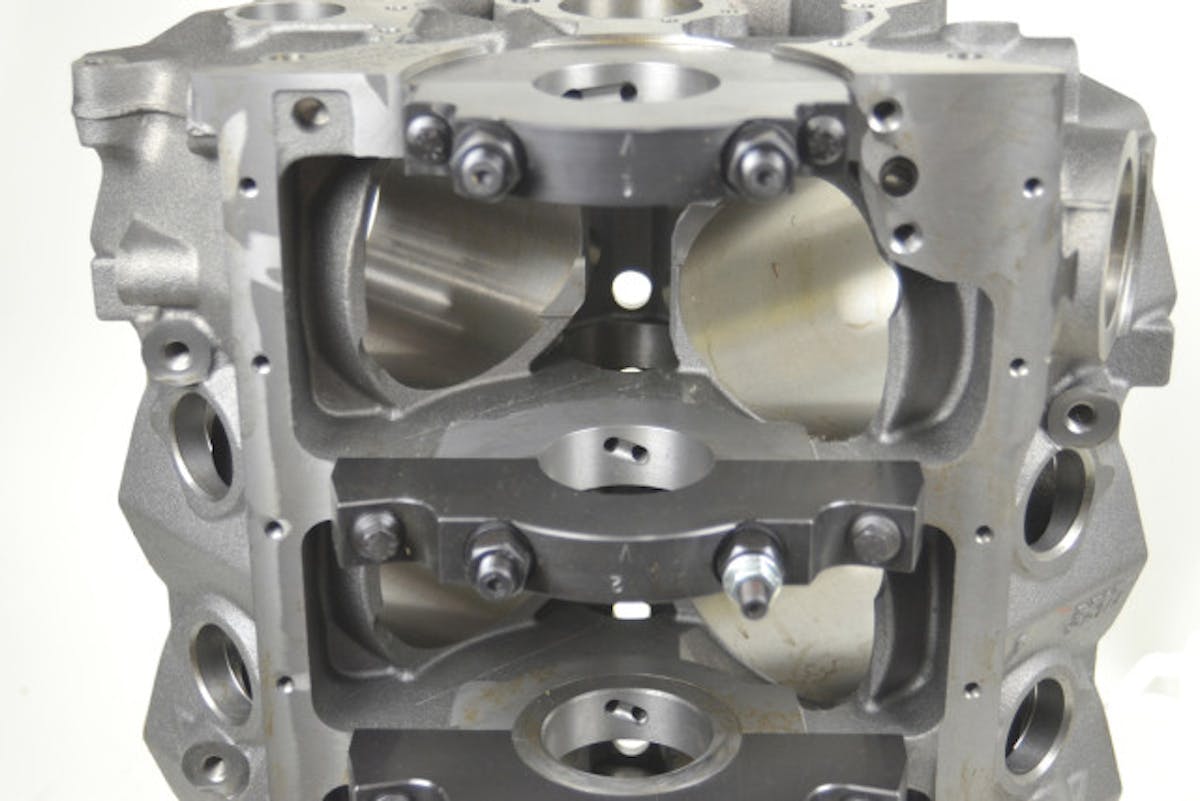 World Products offers the Man O’War, which features a 50,000 psi. iron alloy. It’s has far more material in the main webbing area that surrounds the crank, as well as four-bolt main caps. In this photo you can also see the cylinders extend a ½-inch further into the crankcase, which gives the pistons stability at BDC, and the bores are notched to clear the rotating assembly. It also uses ARP 7/16-inch fasteners to leave more metal in the critical areas.