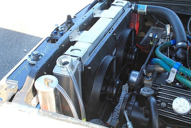 Close up of Project Track Attack‘s Be Cool aluminum radiator and dual fan combination. We went with the direct-fit model, which is good for 700 horsepower. Part number: 80170