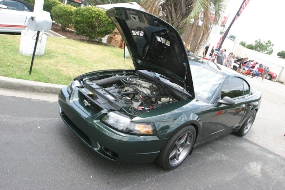 Calvin Atwell always has something up his sleeve when it comes to Mustangs. This year he brought his 2001 Bullitt to the show. If memory serves, he brought his black Bullitt to last year's Mustang Week. That car has a new owner, but it was in attendance, as well. His DHG Bullitt has tasteful mods such as a 1999/2001 Cobra front bumper, 2000 Cobra R wheels, a JLT Performance cold air intake, and a Revolution Automotive tune.