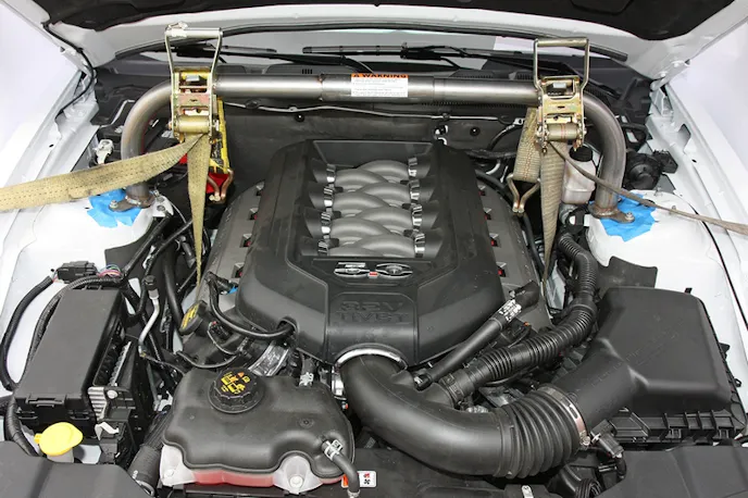 Here you can see the use of ratchet straps to hold the engine up. On the bottom side, the straps hook to the engine mount arm on each side.