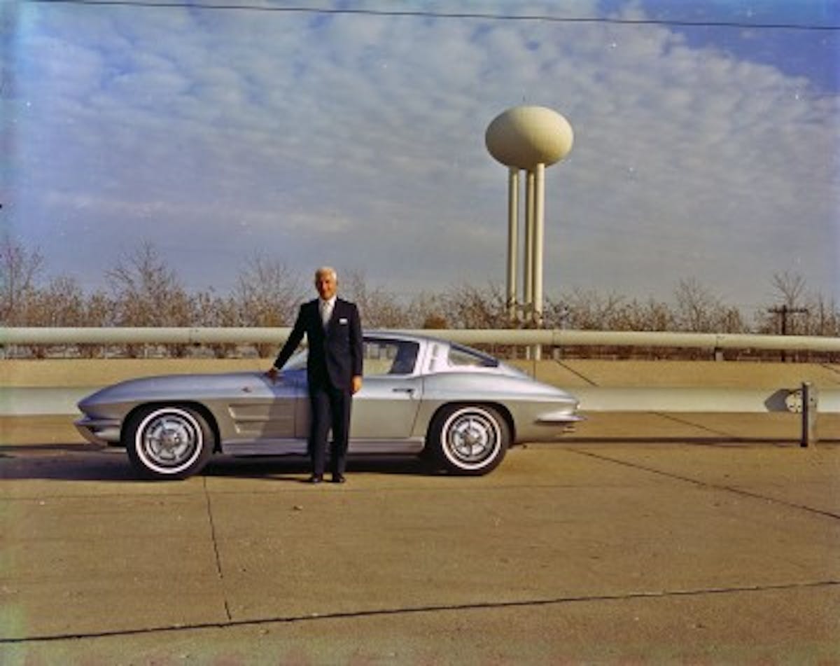 Zora at General Motors Technical Center, Warren, Michigan, with 1963 Chevrolet Corvette Coupe.
