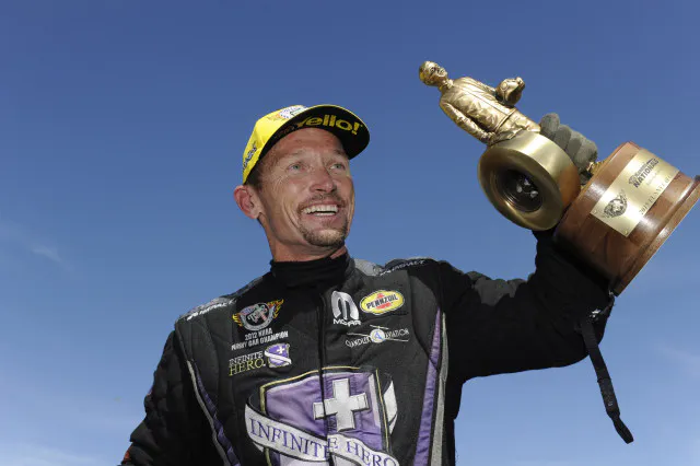 A smiling 'Fast' Jack Beckman hoisted his fifth Wally of the season after a historic weekend for the Infinite Hero Dodge coming out of the Don Schumacher Racing camp.