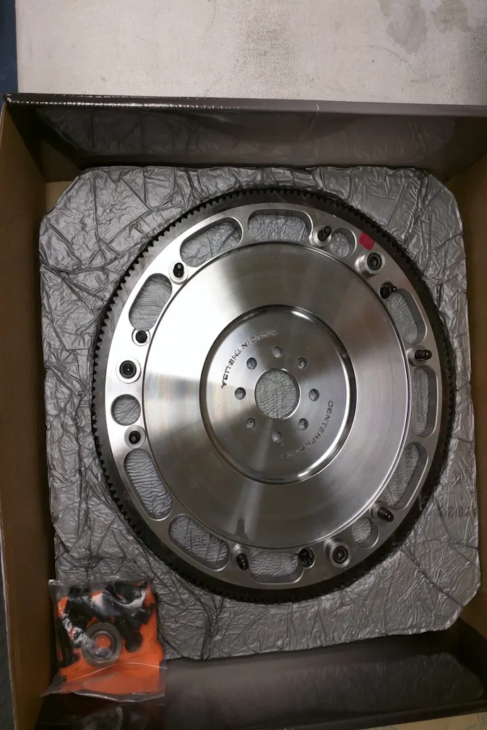 With the pressure plate, both discs, and the floater plate removed, the flywheel is revealed.