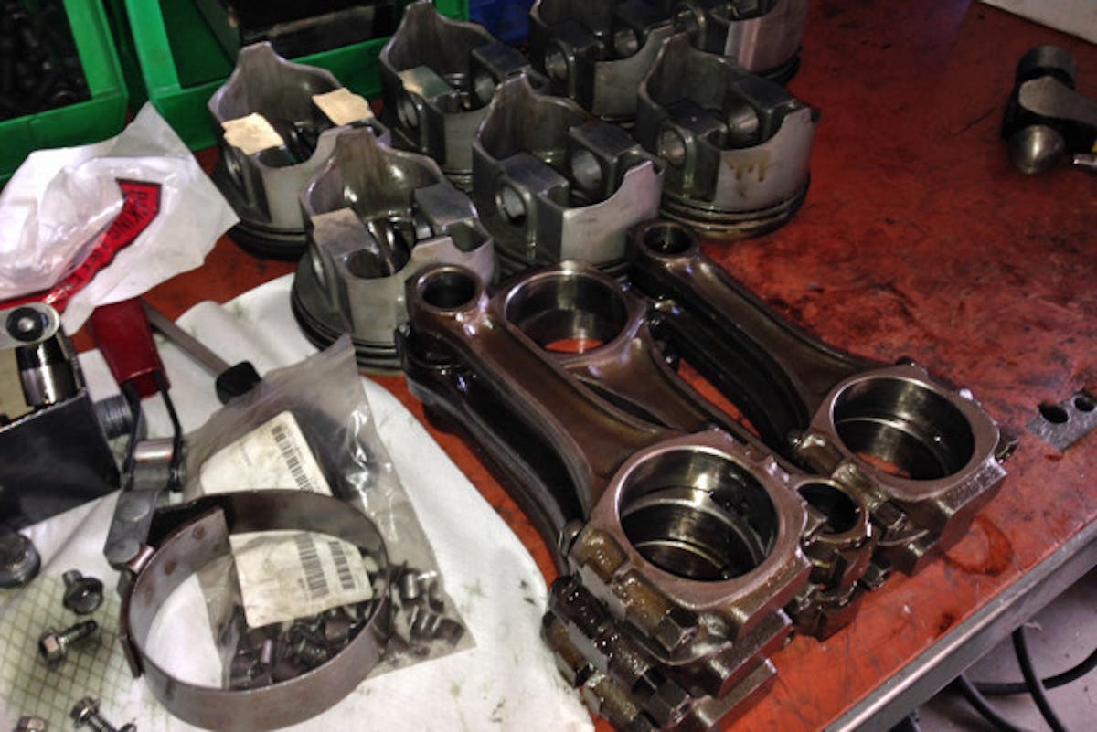 Old, tired pistons and connecting rods in need of love and attention.