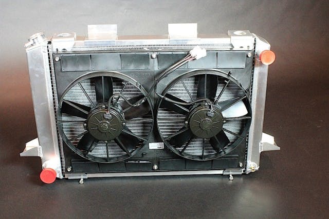 While we're definitely aware Project Track Attack's Be Cool module isn't for an LS swap, we wanted to include the image anyways to highlight the similarities in the LS swap modules. Our Be Cool radiator module is rated at 700 horsepower, included dual 11-inch SPAL fans, and an optional 7-plate cooler for our automatic transmission. Also included were the aluminum mounting brackets, wiring harness and dual 40-amp relays, and an aluminum recovery tank.