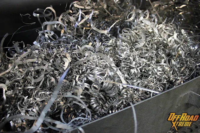 Aluminum shavings pile up below the lathe. Look, but don't touch!