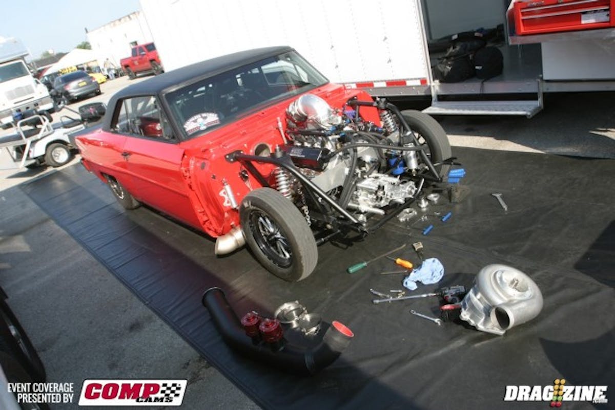 Jarod Wenricks has his unbelievable Chevy II here at Norwalk, and has run in the 4.50s so far in testing for Street Outlaw. He had the front dress off the small block Friday morning to address a vacuum pump issue.