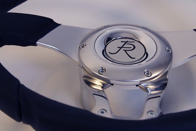 Using the right cleaning products for the various surfaces of the steering components is vital if you want its luster to last. That said, there's no trick to it - polished components like the lower steering wheel spokes and the column itself (in this application) can be shined up with off-the-shelf metal polish, and non-greasy leather cleaner is a safe bet for the gripping surfaces of the wheel.