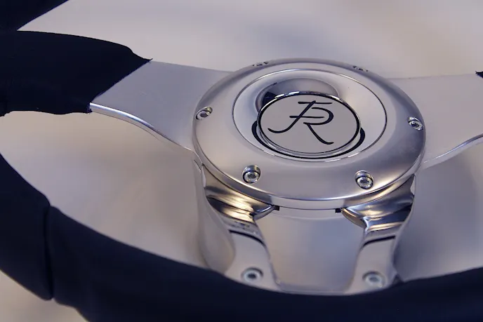 Using the right cleaning products for the various surfaces of the steering components is vital if you want its luster to last. That said, there's no trick to it - polished components like the lower steering wheel spokes and the column itself (in this application) can be shined up with off-the-shelf metal polish, and non-greasy leather cleaner is a safe bet for the gripping surfaces of the wheel.