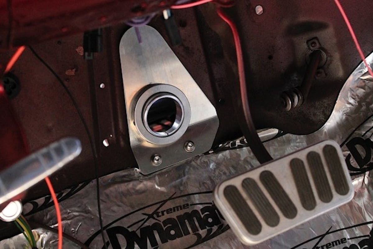 This triangular-shaped swivel floor mount makes installation of a new tilt column in your Classic Tri-5 Chevy simple and attractive. The machined aluminum ball swivels for easy positioning of the column at virtually any angle. Polished aluminum with satin back plate.