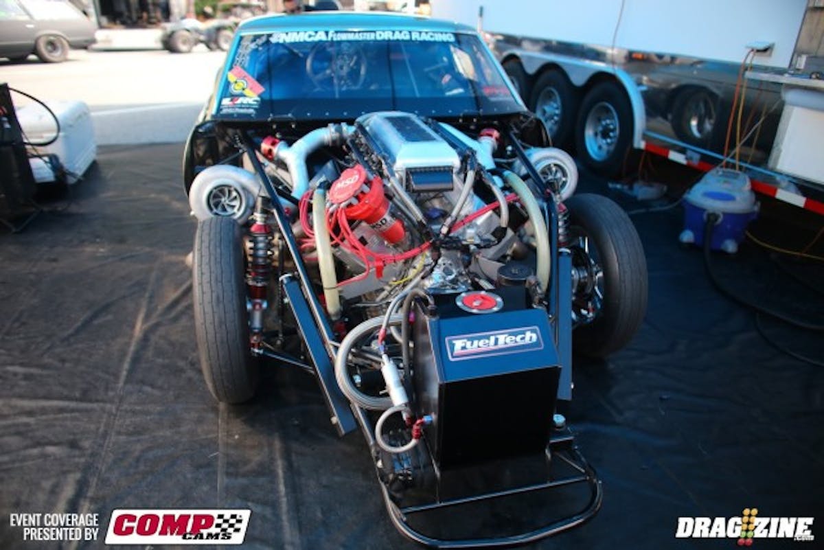 oday, it looks like this--you'd never know it was in an accident. And Mills has it right back on the pace; he clicked off an insane 4.03 at 200.44 mph this morning in the PDR test session. He tells us that was with a 'lazy' 1.129 short time--in 3,000 feet of air. Tomorrow night, it's supposed to be in the low 60's. Will he skip right through the 3.90's and run into the 80s? Only time will tell. Thanks to DeWayne for providing the photo of the car in the shop.