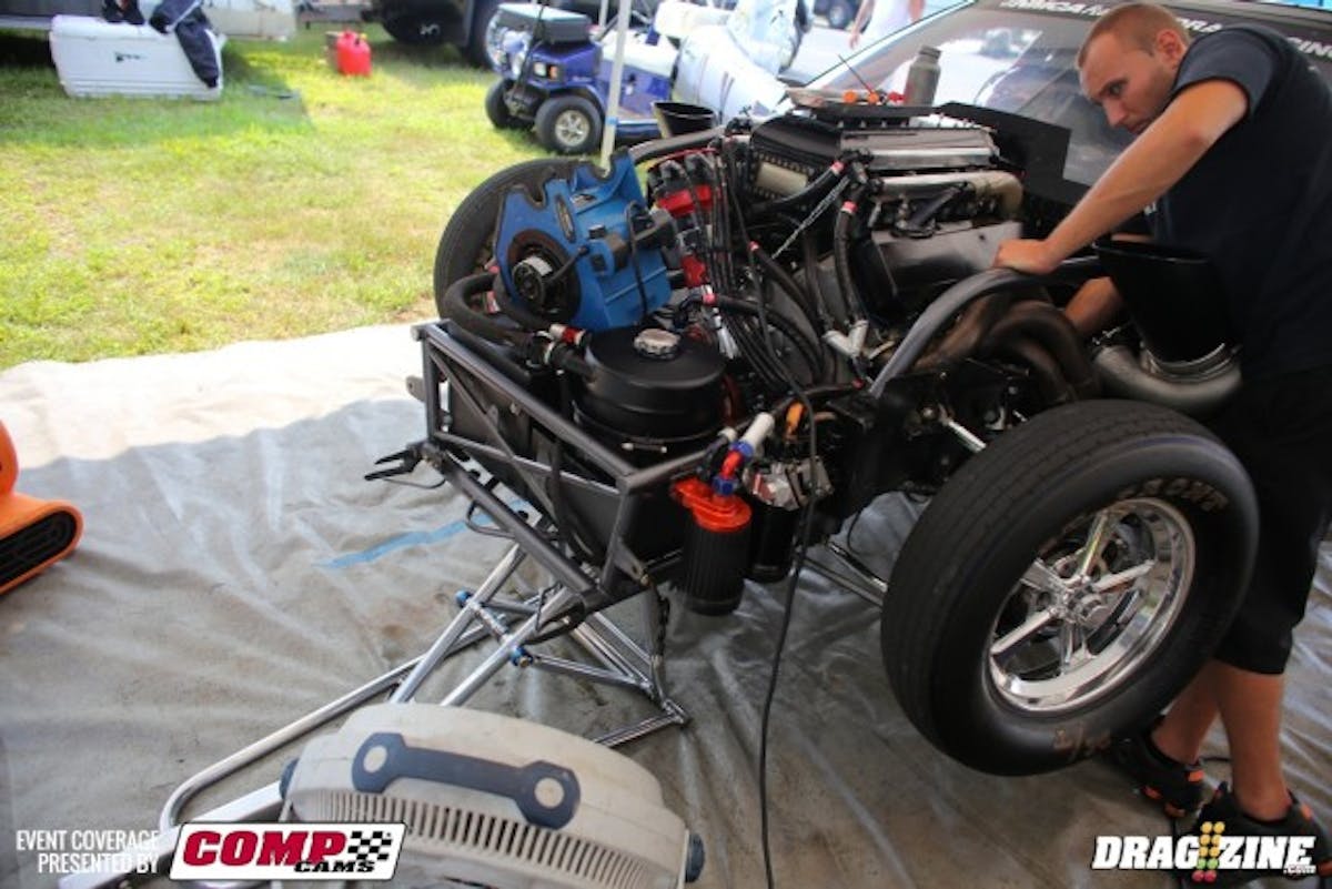 Paul Major's crew was hard at work changing the plugs in his Pro Drag Radial Corvette this morning. Major's made a change to a twin 550 lb./hr. fuel injector setup, which has him rebuilding the tuneup from scratch. He clicked off a 4.35 at 188 mph on his test hit this morning, but the DMC Racing-backed bullet has been 200mph in the past. We expect to see him back on that pace in no time. 
