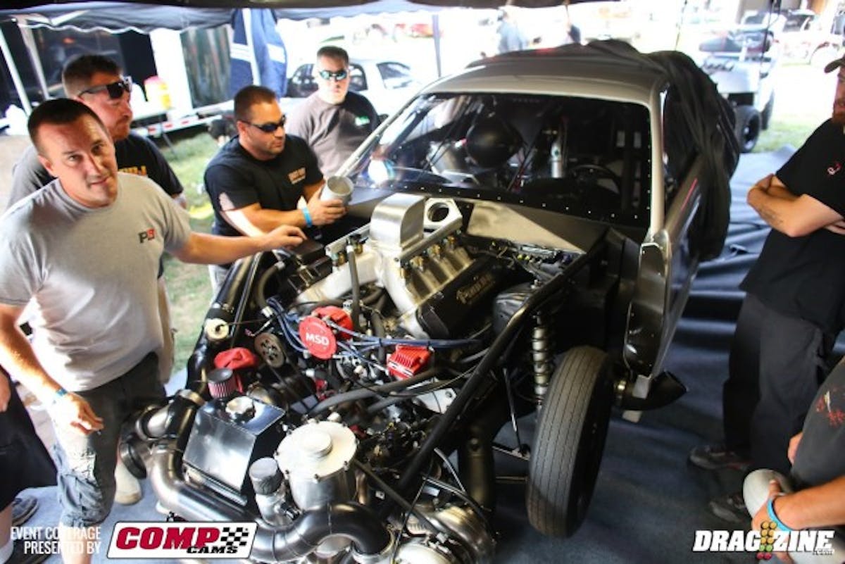 Here's the Johnson team putting the car back together with an older intake manifold Johnson received when he originally purchased the car from Conrad Scarry.