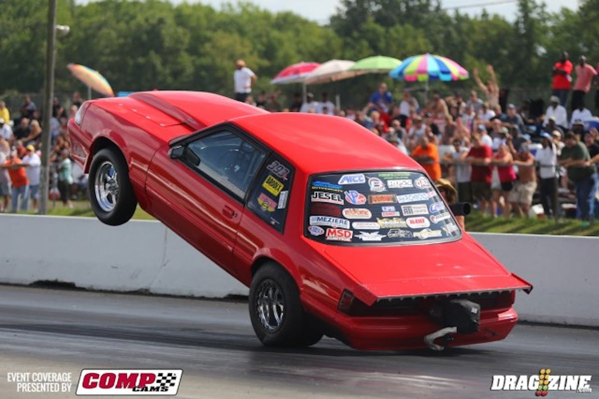 Dan Whetstine's out here with a brand-new combo in his super-clean '91 Mustang. The car wears an F-1R ProCharger atop the Brodix Neal-headed 417 cubic inch powerplant. In the last couple of months, the team switched over to M1 fuel, added a Waterman fuel pump, Billet Atomizer 550 lb./hr. Injectors, and Menscer front struts. Jason Norris from Triton Metals made a new water and fuel tank, then powdercoated all of the new supercharger piping. With this combo he's able to lose 150 pounds from his previous weight. Teammate Tim Essick is ticking the keys on the laptop to bring the tune up to speed. Crewmembers Timmy Savoy and Phillip Buckner also help the program, and Whetstine credits “Awesome Sauce” wife Michelle for the assist on everything he does.He went for a wild ride this afternoon in round two of qualifying.