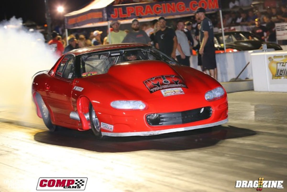 Canadian Nick Agostino crashed his car twice last year while working to figure out the small-block twin-turbo combination. The car uses a 441ci Alan Johnson billet-headed, CN billet block, and a pair of 94mm Precision turbos for motivation. He uses a BigStuff3 and Davis Technologies Profiler to make it all come together, and has thanks for guys like sponsor Mark Micke of M&M Transmissions and Patrick Barnhill for the solid performances. The hard work has paid off--he qualified third with a 4.10 at 201 mph, then posted a 4.15 this morning in his first-round broke bye--with lots of tire shake around 250 feet out.