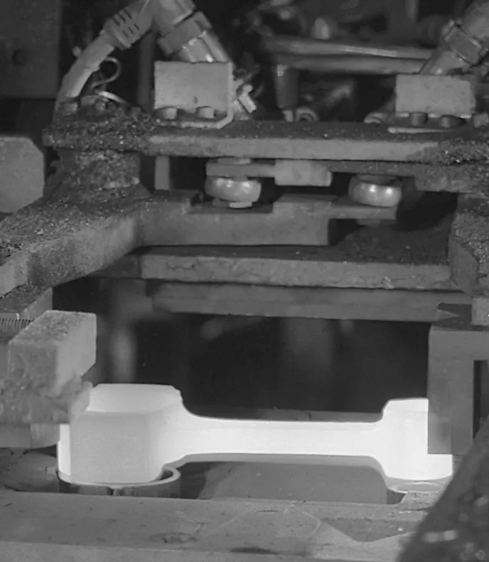 The hot-forging process uses a 750-ton press to ensure the metal's structure is finalized.