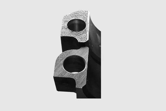 A fractured cap on top, versus a sawed-off cap on the bottom. It's easy to see how the fractured cap is more accurate during the assembly process.