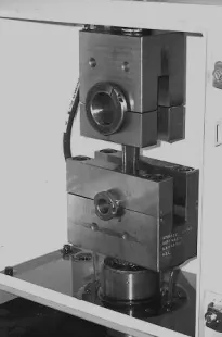 Rods are tested on this cycle tester at load for fatigue and endurance performance.