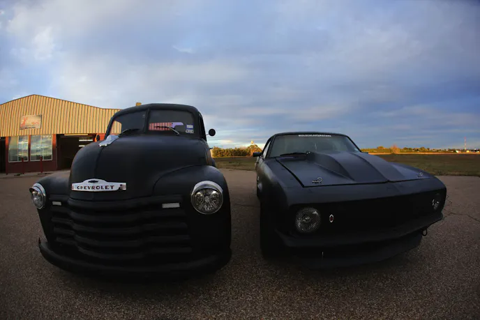 The Zombie Killer pickup and its inspiration, the Black Ops Camaro