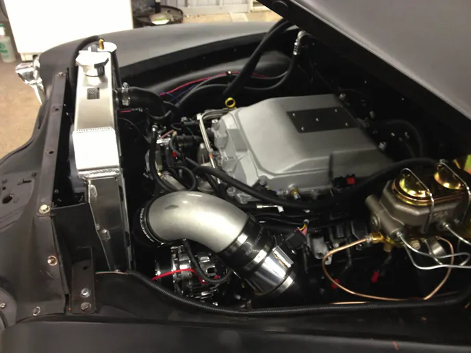 Motivation for the '49 Chevy comes from an LSX 376-B8 topped by a hot rodded LSA blower.