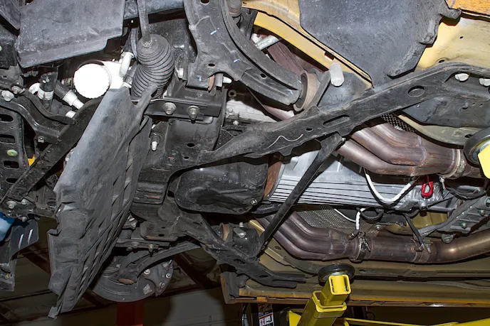 Beginning the prep under the car. Splash shield removed.