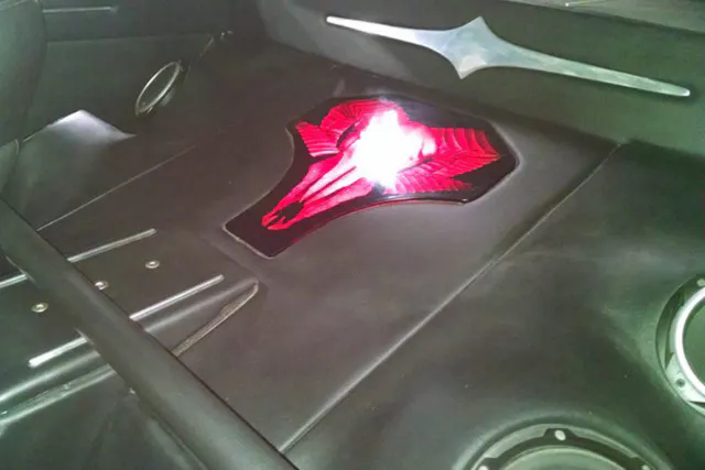 The LED-lit Ram logo taking up the backseat doubles as a speaker box. Photo courtesy ASK Rods & Customs-Facebook.