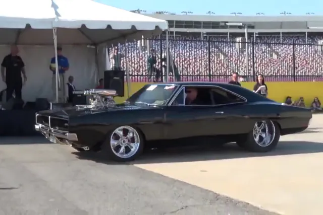 Meet Roxanne. She's got a 572 cubic inch Hemi somewhat under the hood. Screenshot from video.