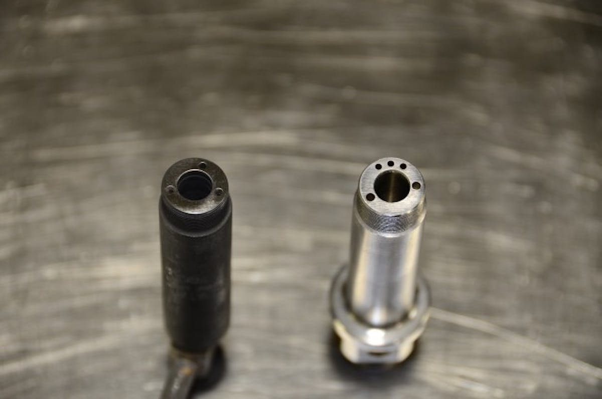 At left is a stock, IH injector body with a single feed. At right, additional fuel-feed holes are evident in a Scheid billet tri-feed injector body.