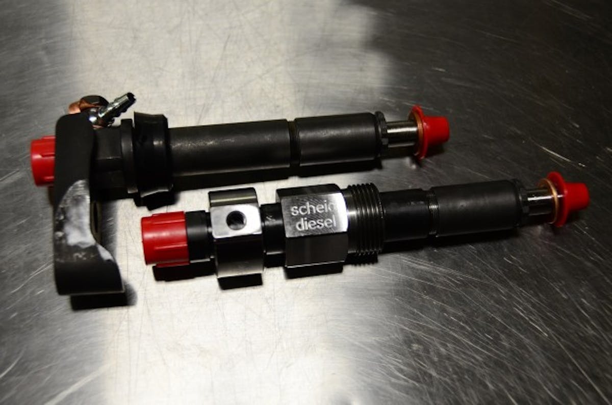 Scheid’s injector assemblies are designed for high-flow, high-load applications. Made of chromoly with more material than a factory unit, they have more tensile strength and custom feed passages. At top is an IH type for a Navistar DT466. The lower unit is for a Cummins B-series.