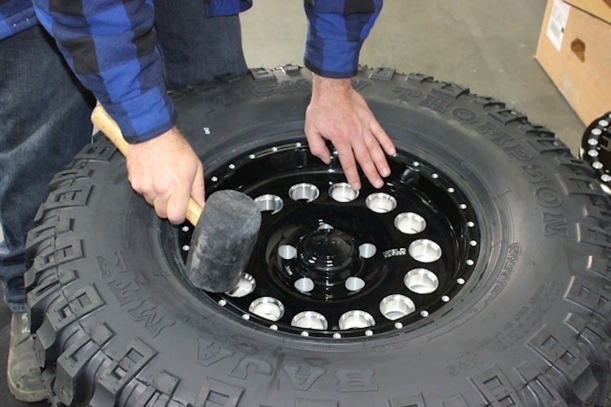 A bit of massaging with a rubber mallet may be needed in some cases to get the tire bead to firmly seat into the wheel’s beadlock flange.