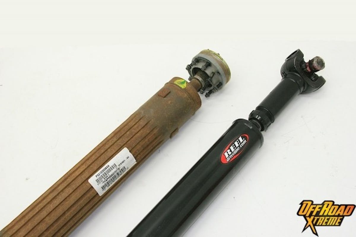 The J.E. Reel driveshaft (right), while stronger, is noticeably smaller in overall diameter than the stock driveshaft (left). This permits the Reel driveshaft to be used on Jeeps with lifts between 2.5-4.5 inches, free and clear of the exhaust system and other components, and still have greater articulation.