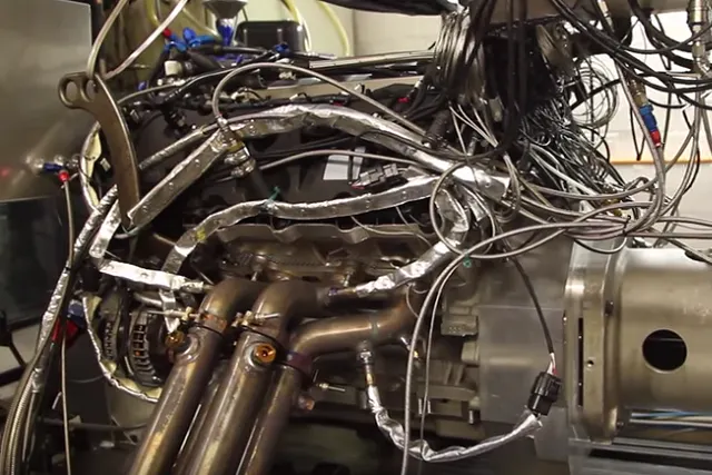 Beneath all the tubes and wiring is a Cosworth-tuned Coyote V8.