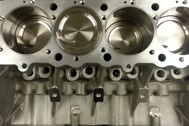 Custom dished pistons from JE provide the needed compression and strength for the BBC monster.