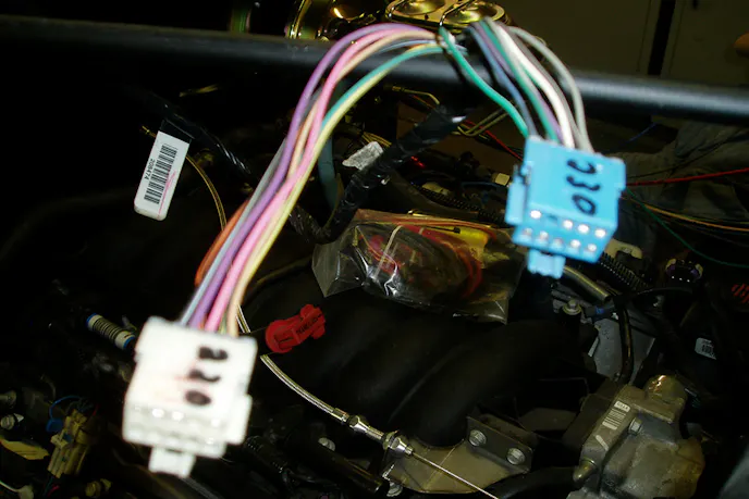 Jim had lots of help from friends, one of whom pinned out the wiring harness so everything would work.