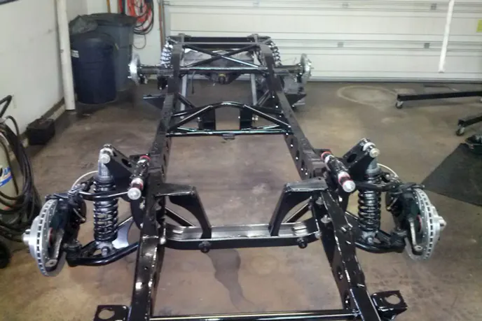 With the body off you can see the suspension mods Jeff did, although these weren't required for the LS swap.