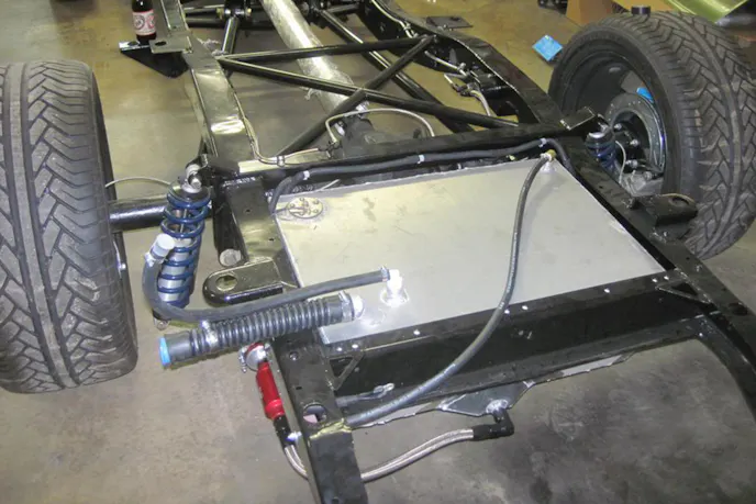 The sumped fuel tank hiding the secondary fuel pump feeding the beast under the hood.