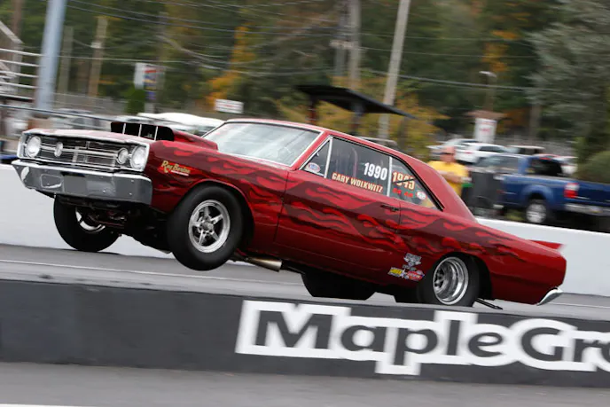 Barton goes wheels up in Gary Wolkwitz's 8-second Dart.