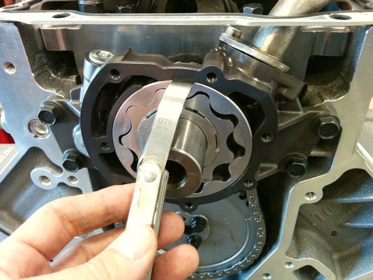 Steven Balusik Melling says the 10295 high pressure oil pump is calibrated to give a 10% increase of oil pressure. The feeler gauges were used to assure that the pump was properly centered on the crankshaft before the bolts were tightened.
