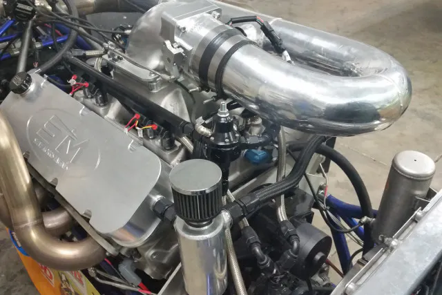 Placing the turbocharger in the rear of the engine compartment uncluttered the area behind the driver substantially.