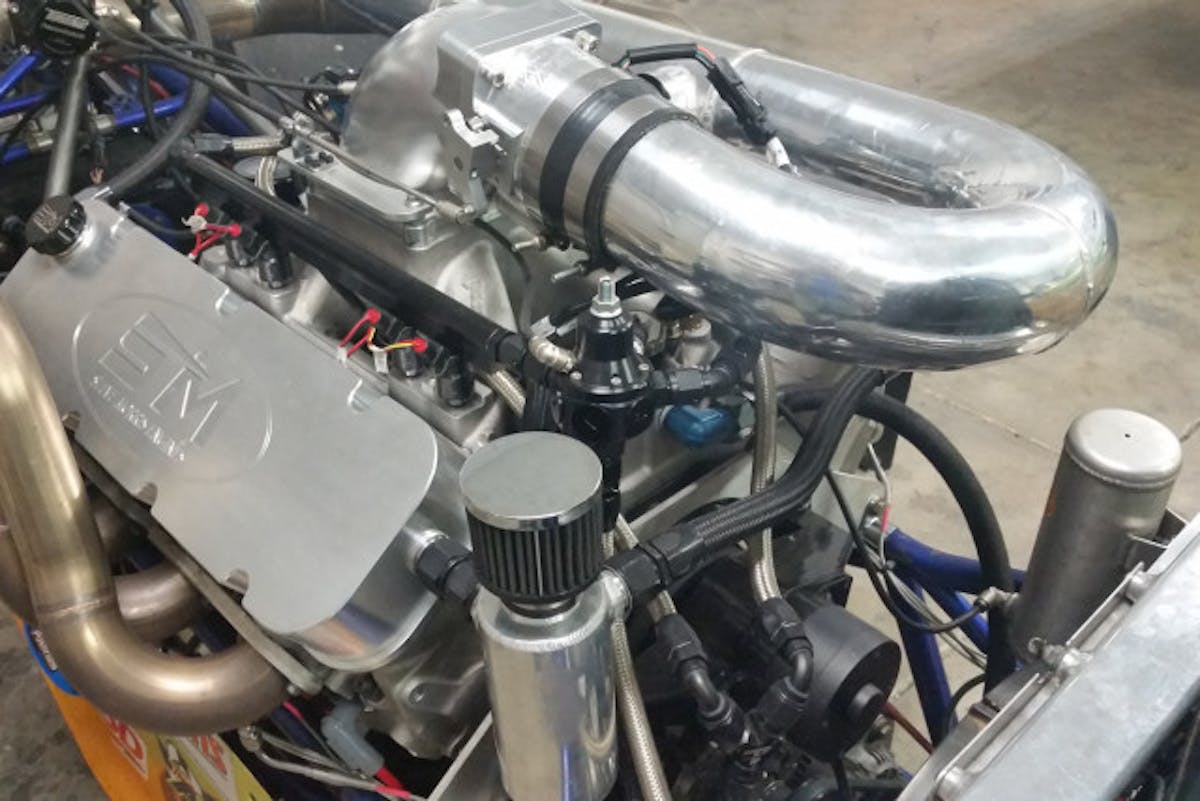 Placing the turbocharger in the rear of the engine compartment uncluttered the area behind the driver substantially.